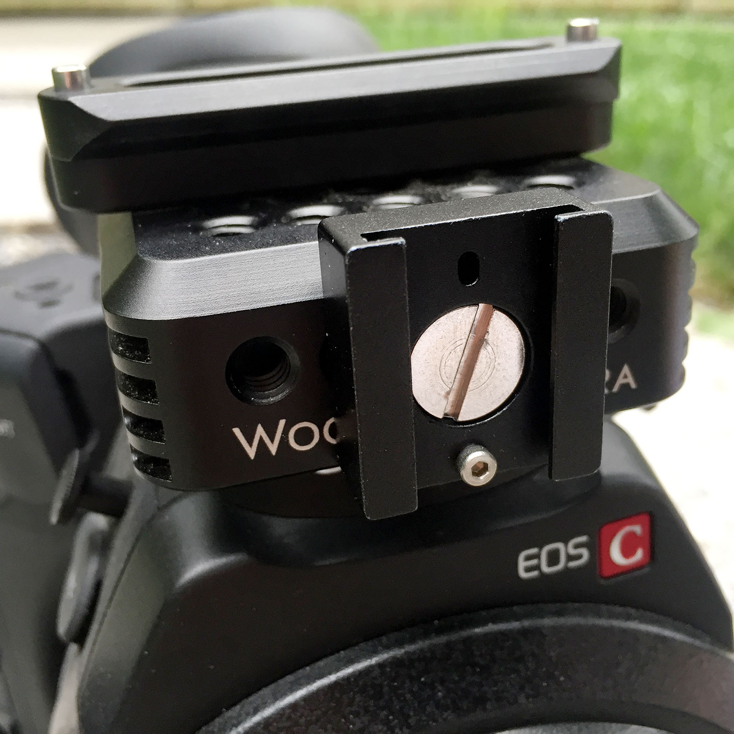 Wooden Camera's Universal Hot Shoe mounted on the front face of the C300 Top Plate. It is long enough fit the C300 Monitor's foot and it has a notch for the foot's locking pin.