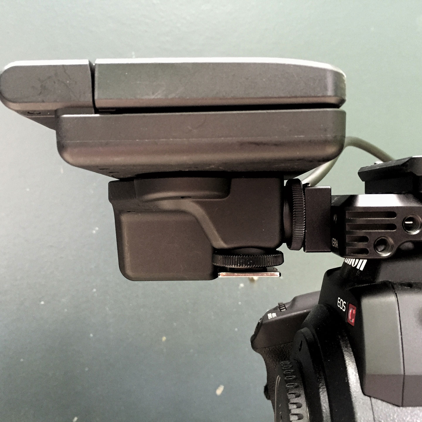 The Canon C300 Monitor mounted via its vertical foot and a Wooden Camera Universal Hot Shoe on a C300 Top Plate.